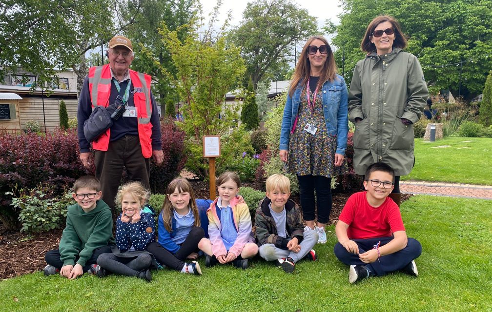 Infant pupils unveil new jubilee tree in gardens at Clarks Village